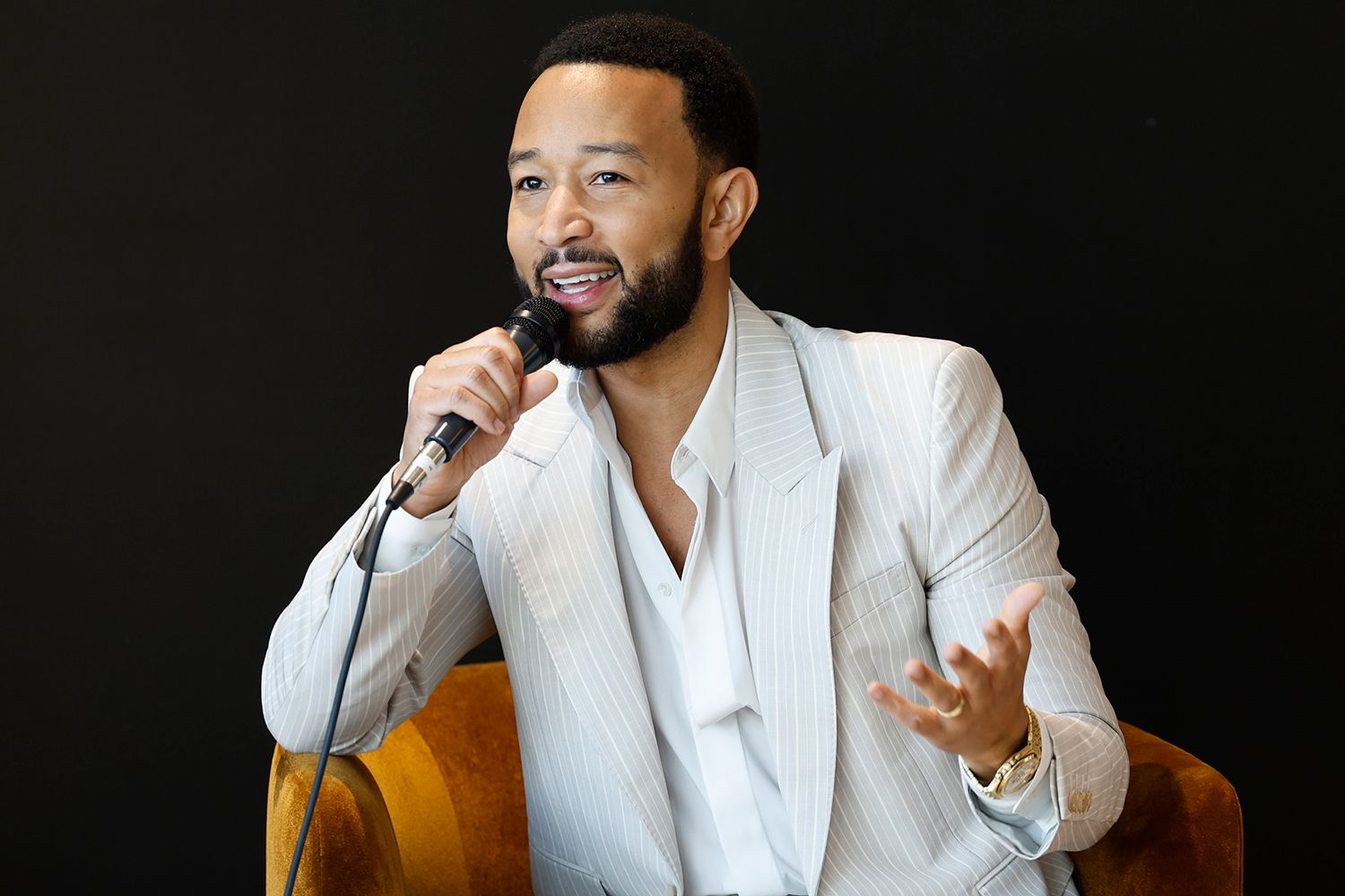 John Legend speaks on stage at The Voices of Beauty Summit at California Market Center on March 27, 2024 in Los Angeles, California. 