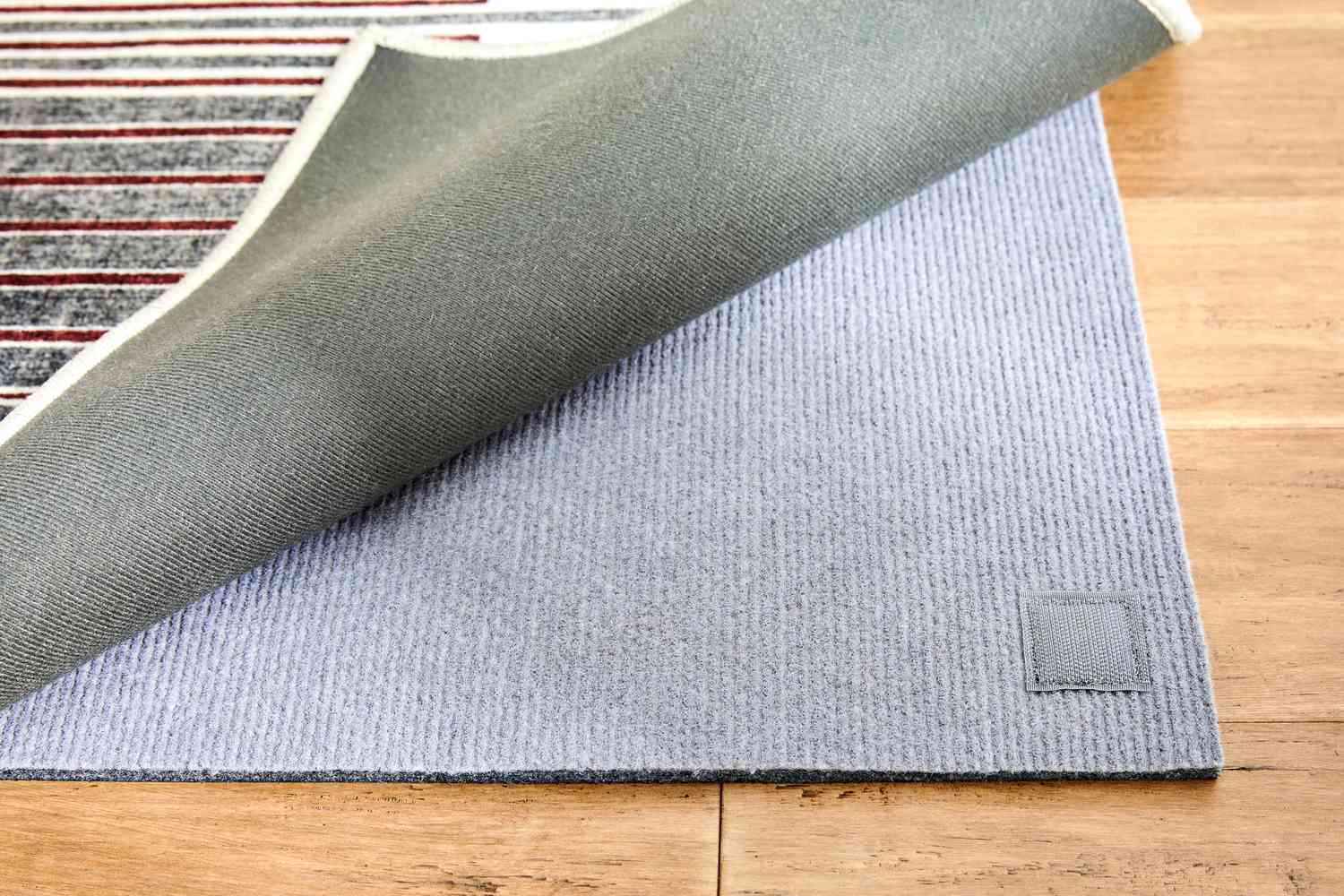 One side of the Ruggable Gradasi Premium Rug lifted up