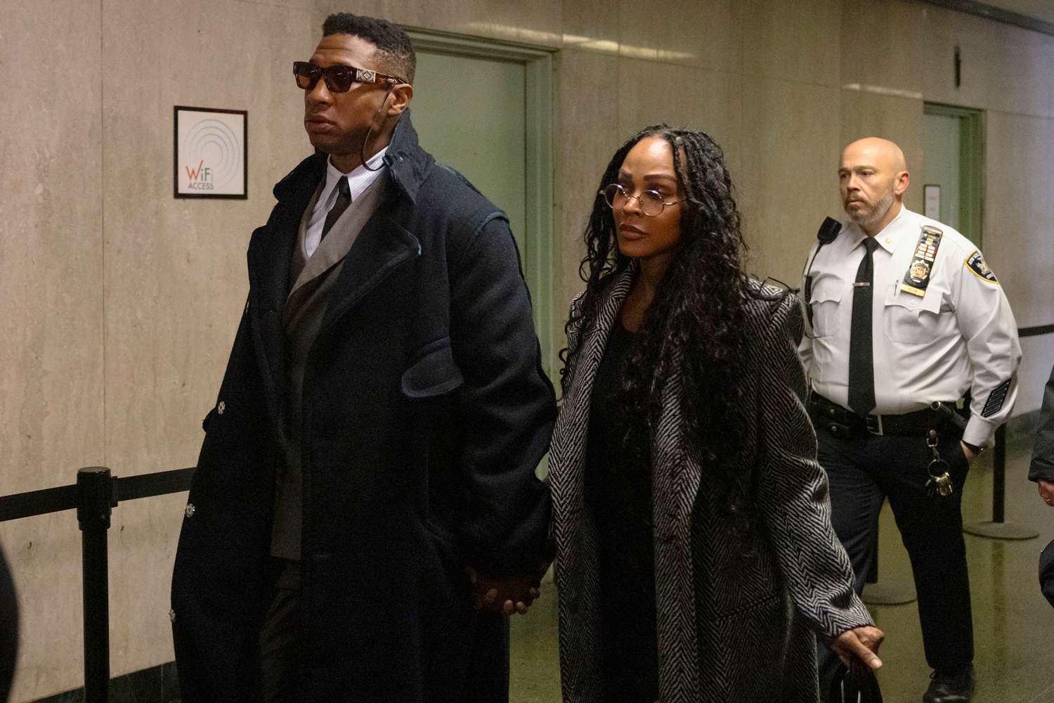 Jonathan Majors, left, and Meagan Good arrive at court for a jury selection on Major's domestic violence case, Wednesday, Nov. 29, 2023, in New York