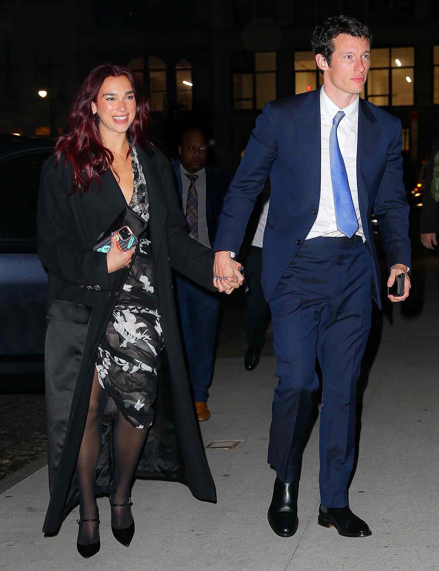 Dua Lipa is all smiles while holding hands with boyfriend Callum Turner as they arrive at Zero Bond for a romantic dinner after her Performance at the Time 100 in New York City