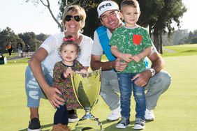 Bubba Watson poses with wife Angie and children Dakota and Caleb after winning the Northern Trust Open at Riviera Country Club on February 21, 2016 in Pacific Palisades, California