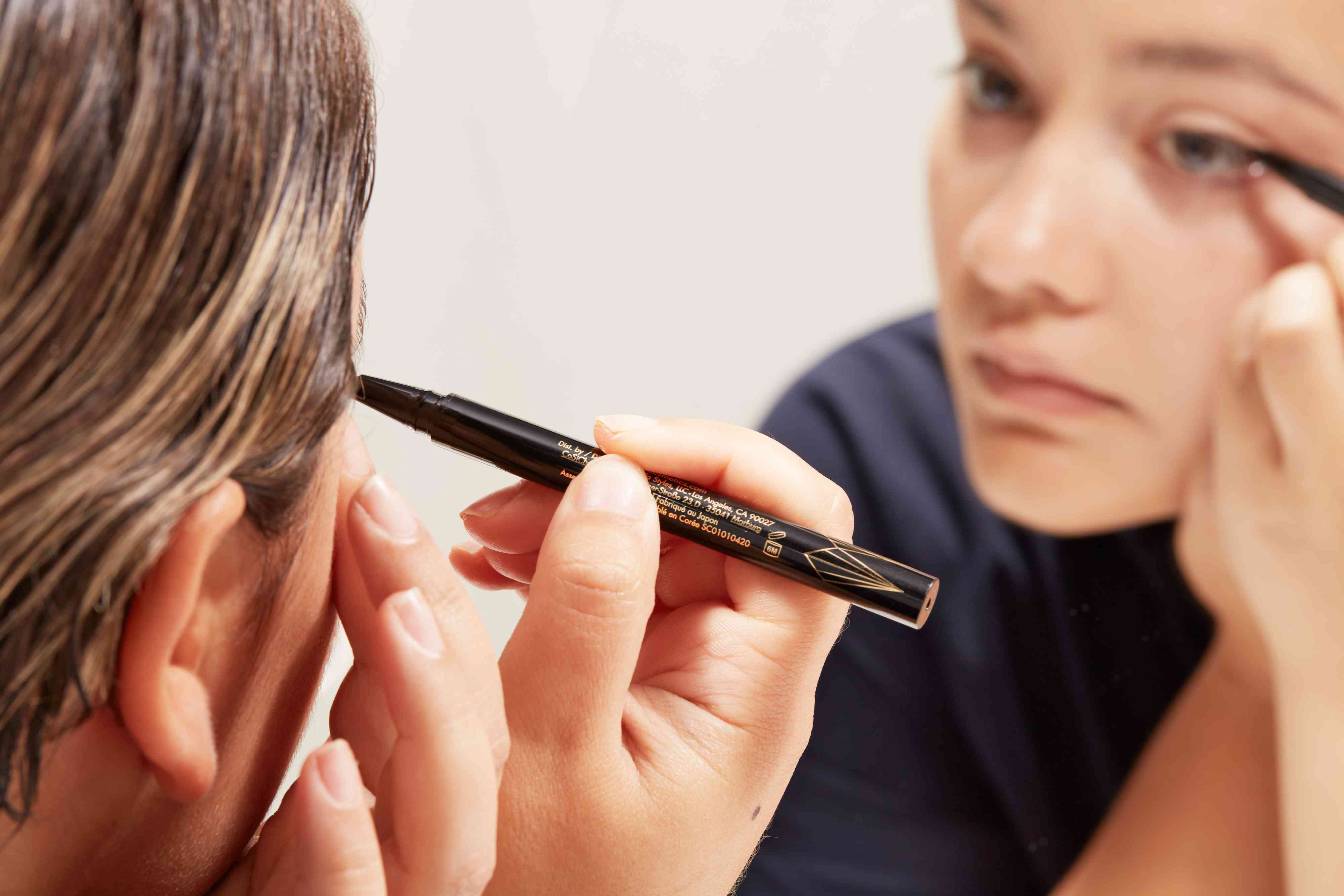 A person using the Stila Stay All Day Waterproof Liquid Eye Liner