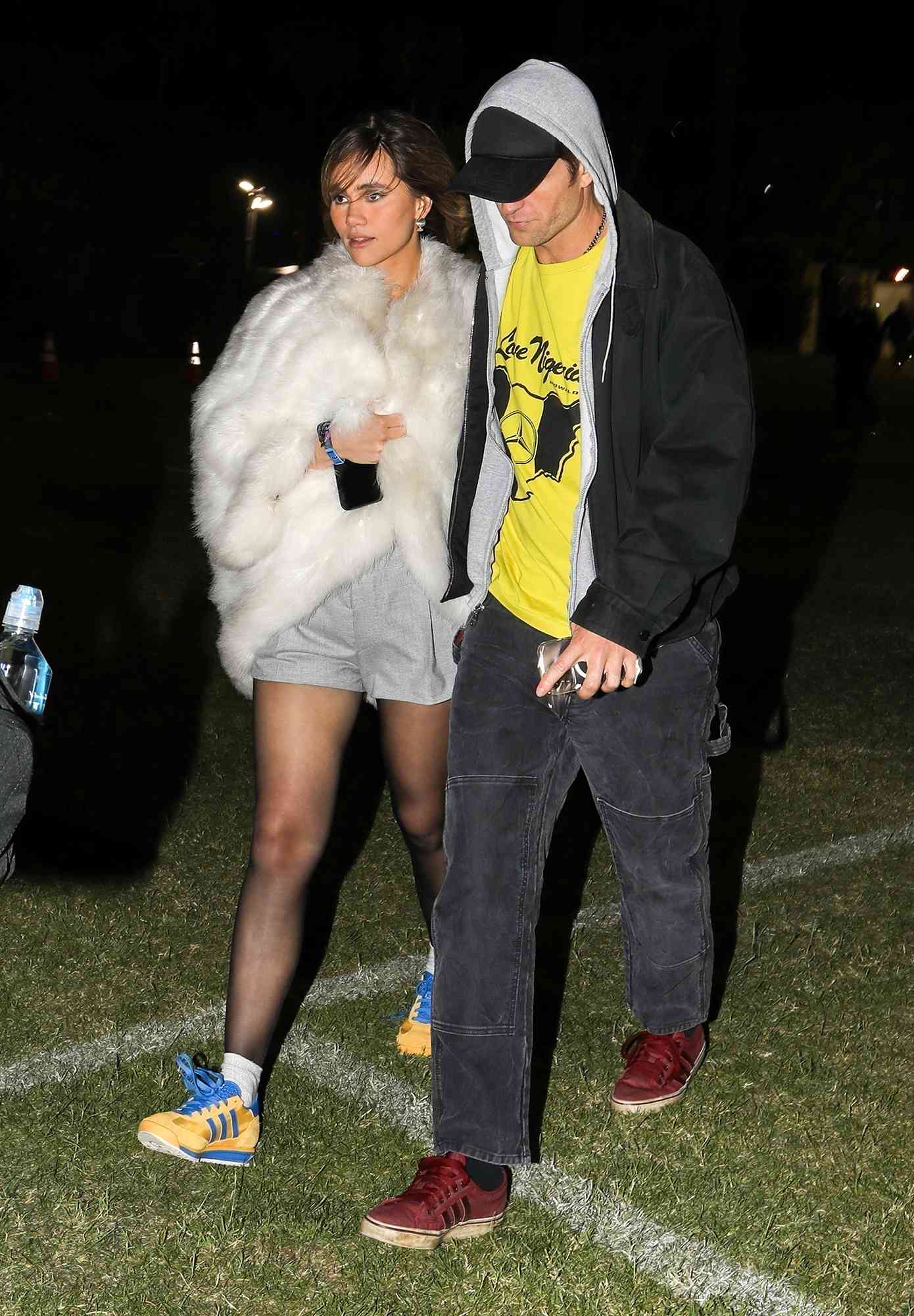 New parents Robert Pattinson and Suki Waterhouse seize a moment of respite from their newfound parental responsibilities, indulging in the vibrant atmosphere of the Coachella Valley Music and Arts Festival in Indio. Suki only months out from giving birth is spotted after her Weekend 1 performance with her fiance Rob Pattinson by her side.