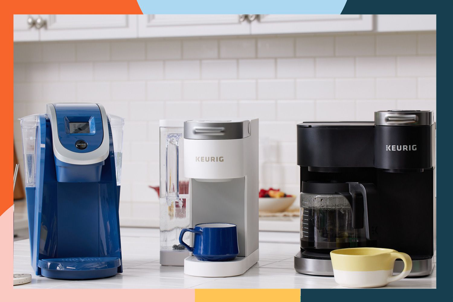 Three Keurig coffee makers on a counter with a colorful border.