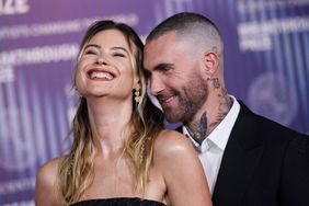 Namibian model Behati Prinsloo (L) and US singer Adam Levine arrive at the Tenth Breakthrough Prize Ceremony at the Academy Museum of Motion Pictures in Los Angeles, California, on April 13, 2024. 