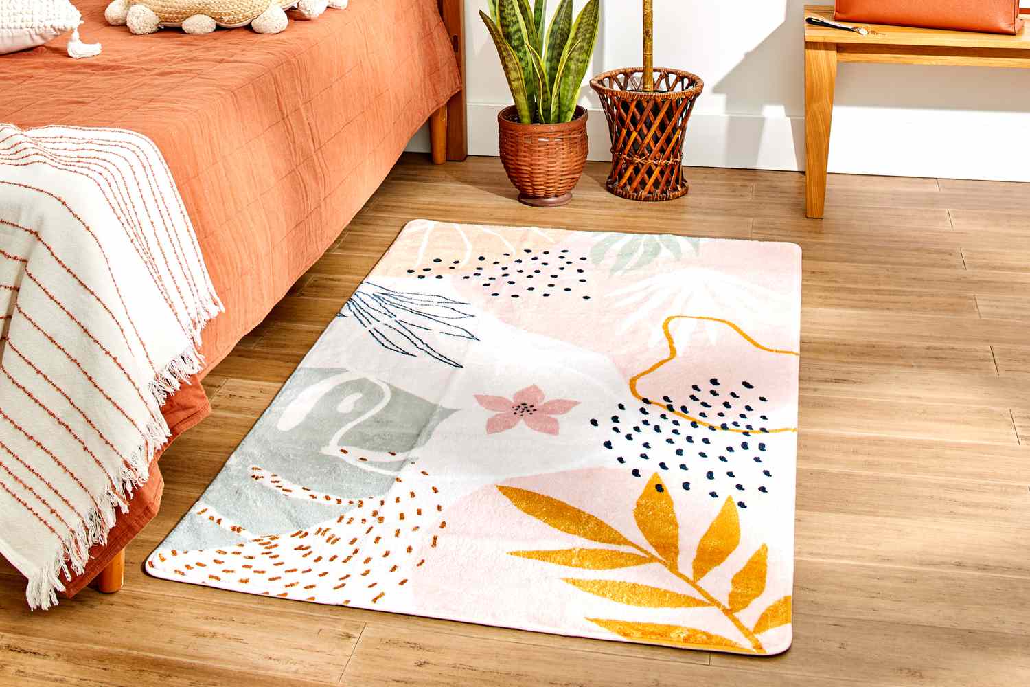 The Lahome Washable Area Rug in a bedroom setting 