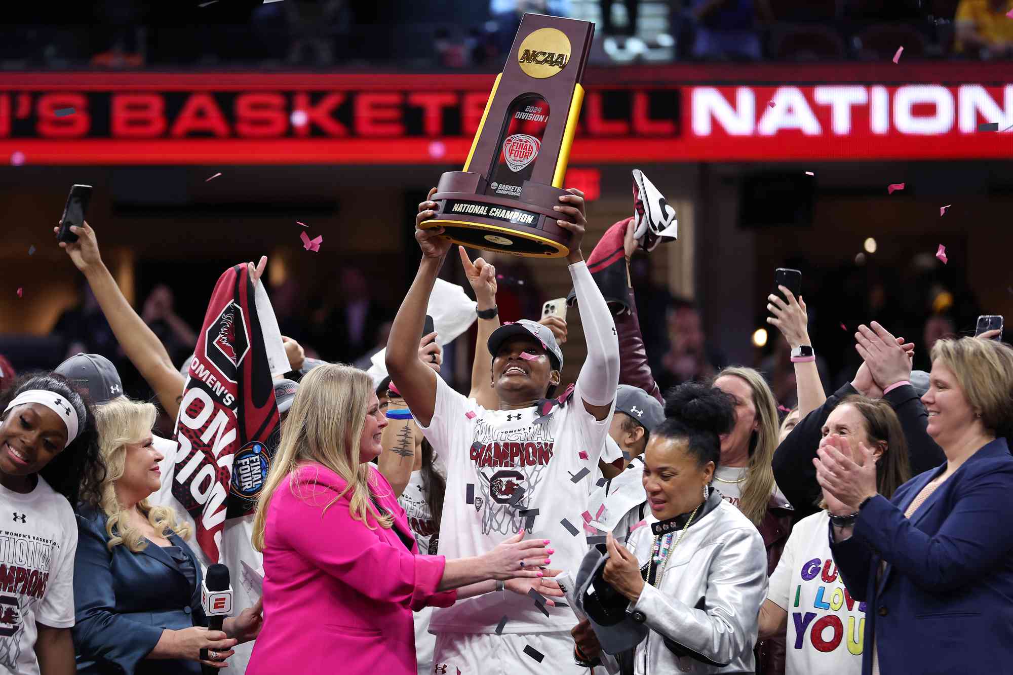 The South Carolina Gamecocks celebrate with the trophy after beating the Iowa Hawkeyes in the 2024 NCAA Women's Basketball Tournament National Championship at Rocket Mortgage FieldHouse on April 07, 2024 in Cleveland, Ohio. Iowa beat South Carolina 87-75.