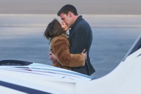 Ben Affleck and Jennifer Lopez pack on the PDA as her pilot waits ahead of a flight out of LA