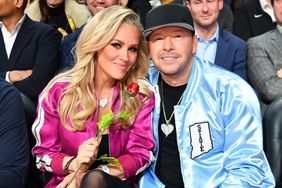 Jenny McCarthy and Donnie Wahlberg pose for a photo during the NBA All-Star Game as part of NBA All-Star Weekend on Sunday, February 18, 2024 at Gainbridge Fieldhouse in Indianapolis, Indiana.