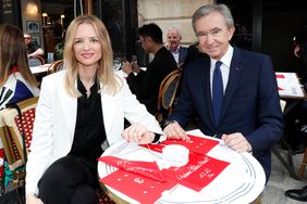 Louis Vuitton's executive vice president Delphine Arnault and Owner of LVMH Luxury Group Bernard Arnault attend the Louis Vuitton Menswear Spring Summer 2020 show as part of Paris Fashion Week on June 20, 2019 in Paris, France.