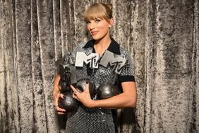 Taylor Swift is seen backstage with the Best Artist, Best Video, Best Pop and Best Longform Video Awards during the Best MTV Europe Music Awards 2022