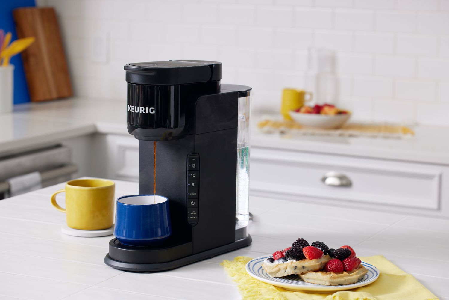 Keurig K-Express Single Serve Coffee Maker sits on counter next to breakfast dish