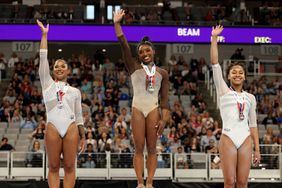  Second place winner Jordan Chiles, first place winner Simone Biles and third place winner Skye Blakely pose on the podium for the uneven bars during the 2024 Xfinity U.S. Gymnastics Championships at Dickies Arena on June 02, 2024 in Fort Worth, Texas