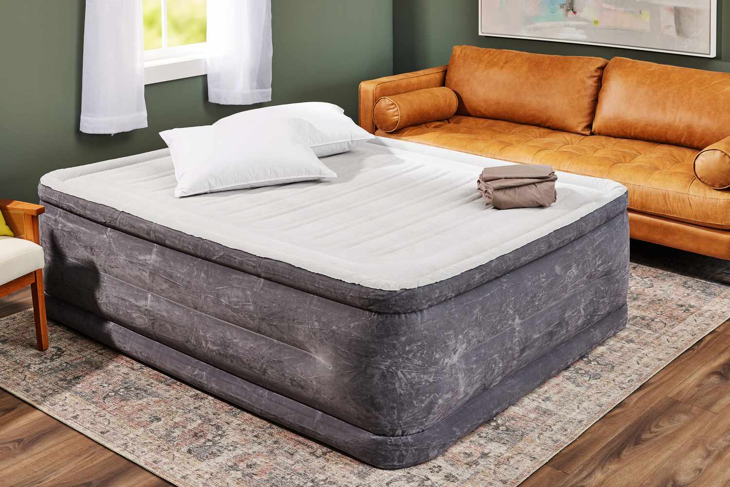 The INTEX 64417ED Dura-Beam Deluxe Comfort-Plush High-Rise Air Mattress fully inflated