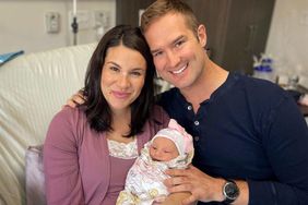 Morgan Chesky and his wife Olivia pose with their newborn baby
