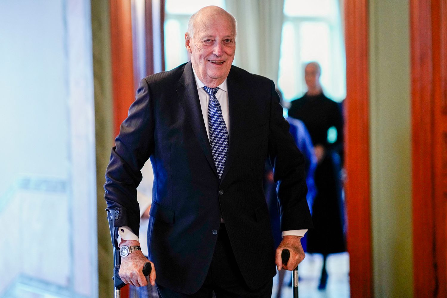 King Harald V of Norway walks on crutches on his way to lunch with members the Norwegian government, on February 24, 2024 in Oslo, Norway. 