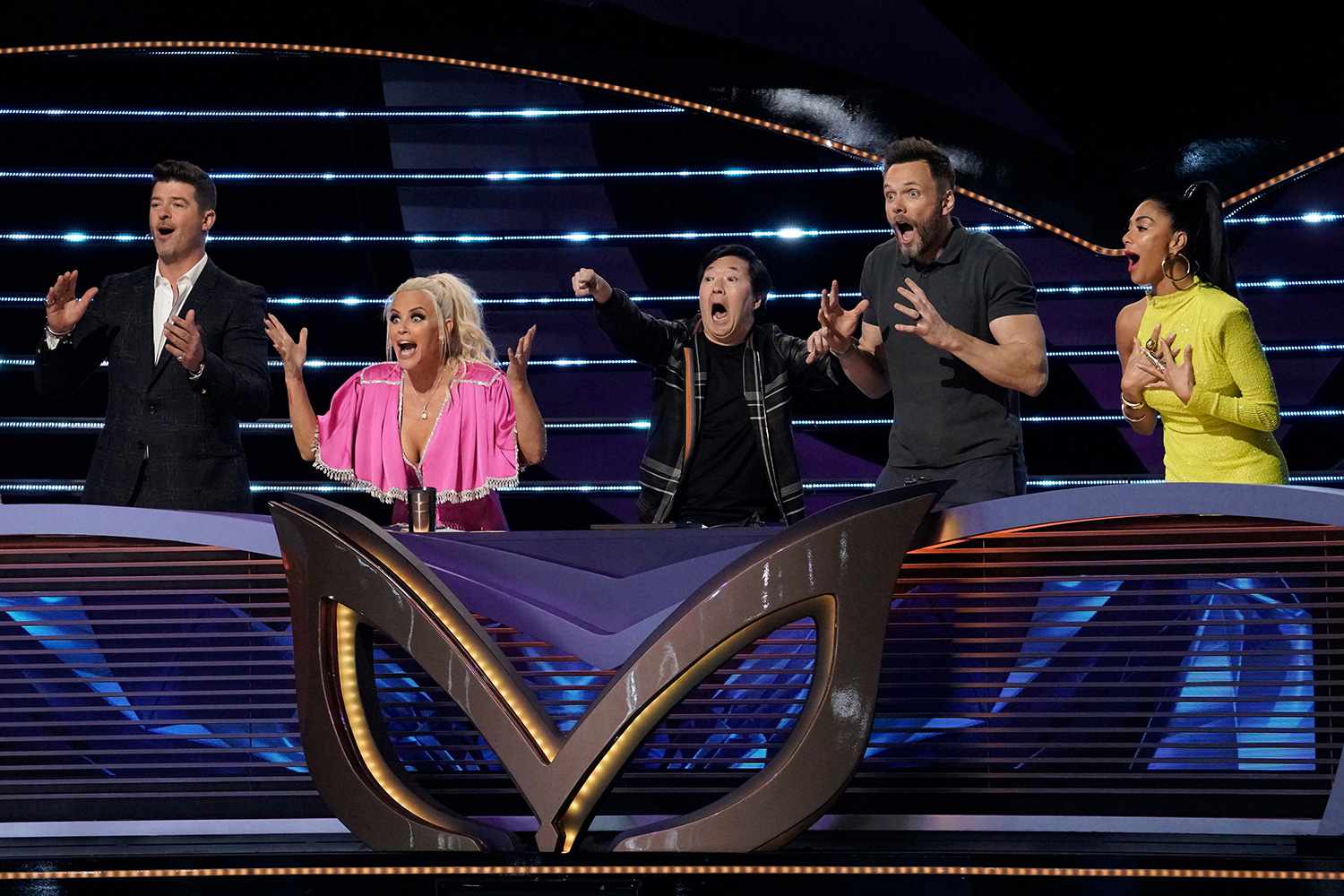The Masked Singer: L-R: Robin Thicke, Jenny McCarthy, Ken Jeong, guest panelist Joel McHale and Nicole Scherzinger in the &ldquo;It Never Hurts to Mask: Group C Playoffs&rdquo; episode of THE MASKED SINGER airing Wednesday, March 18