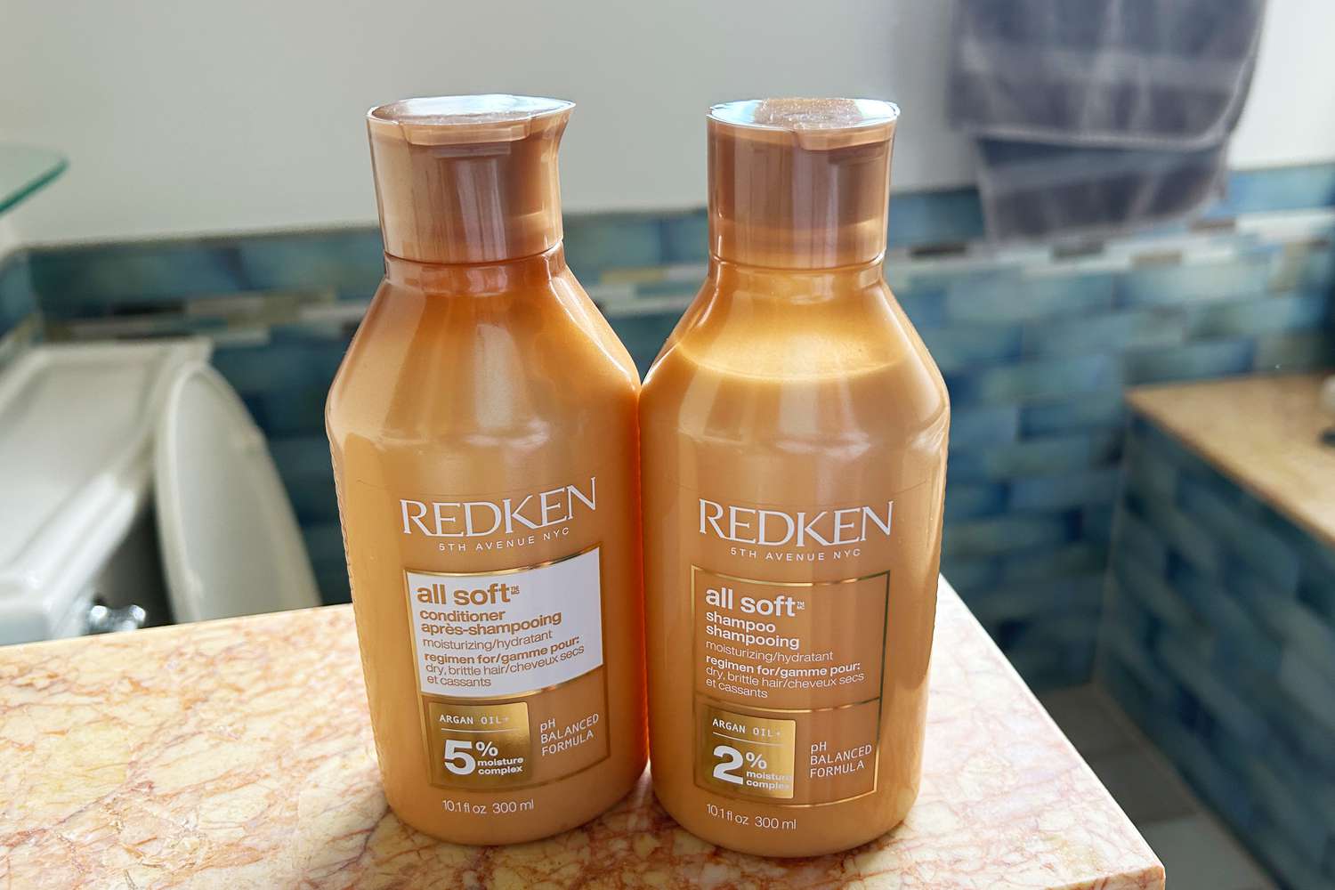 Bottles of the Redken All Soft Shampoo and Conditioner