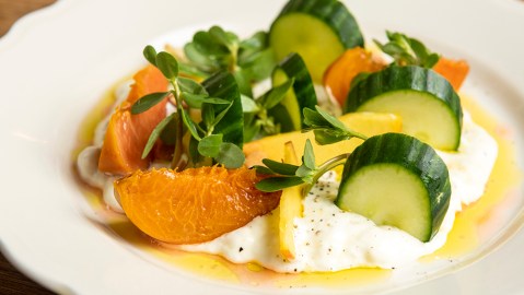 Smashed burrata with peaches and cucumber