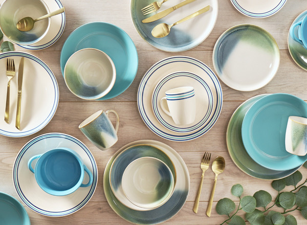 Dinner plates, side plates, bowls, mugs, and soup bowls in blues, greens, creams, and stripes.