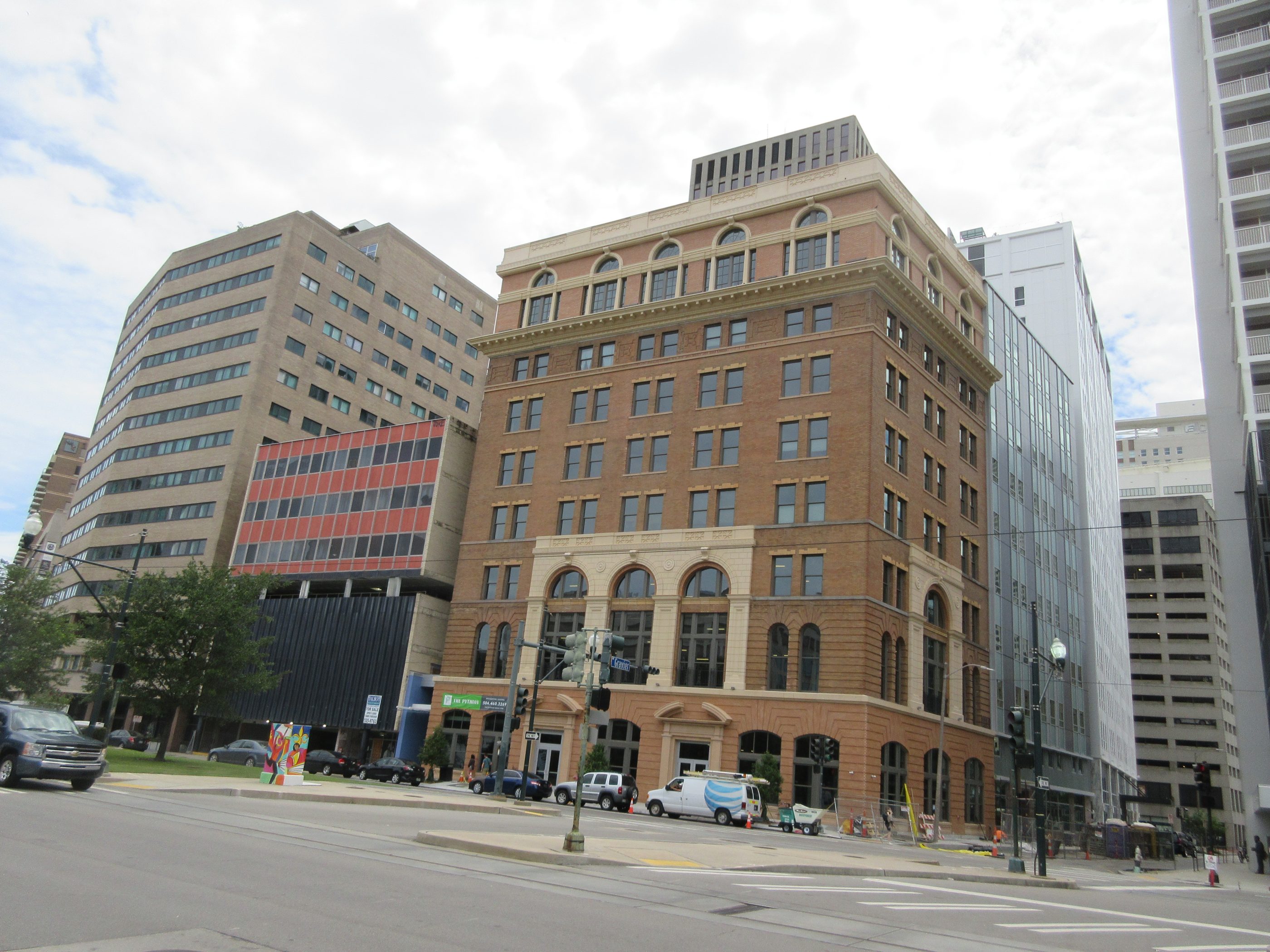 View from across the street of a restored nine-story building dating from 1909. The facade is brick and terra cotta, with arch details over the second-story windows and on the top floor windows.