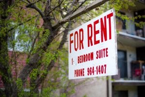 A for rent sign for a 1 bedroom suite. New companies are coming out to ease the burden of coming down with a lump sum security deposit, but are they really helping tenants?