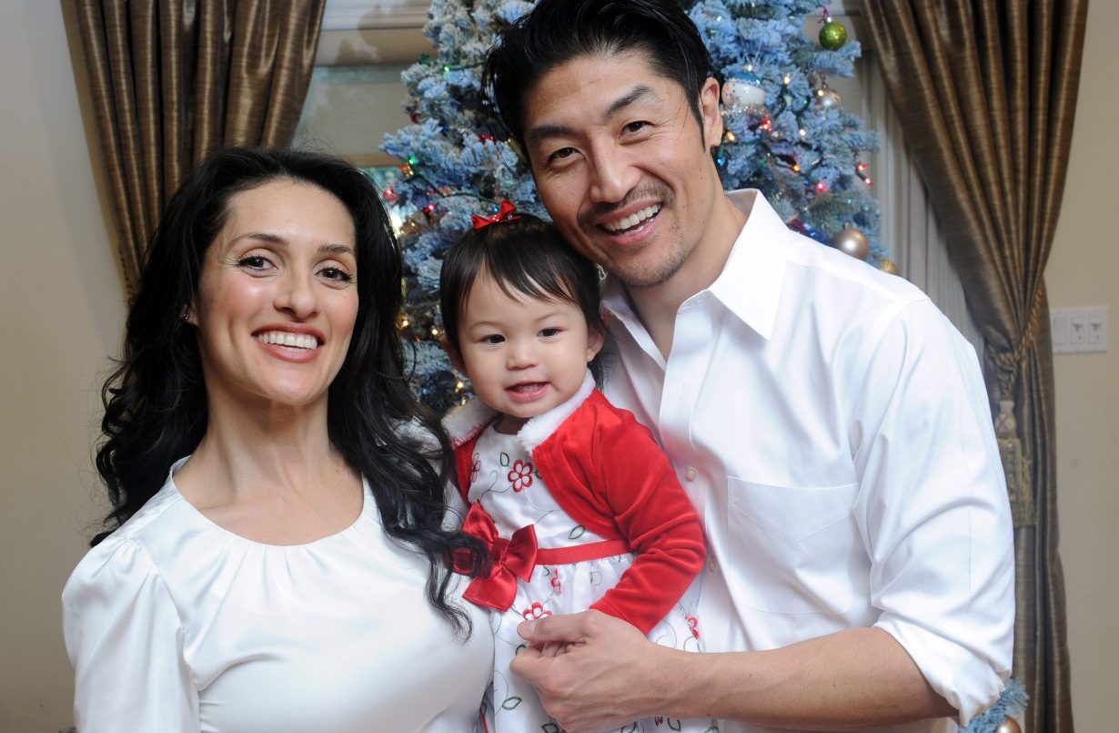 LOS ANGELES, CA - DECEMBER 22: Actor Brian Tee of NBC's "Chicago Med", wife/actress Mirelly Taylor and daughter Madeline Skyer Tee pose in front of the Christmas Tree on December 22, 2016 in Los Angeles, California. (Photo by Albert L. Ortega/Getty Images)