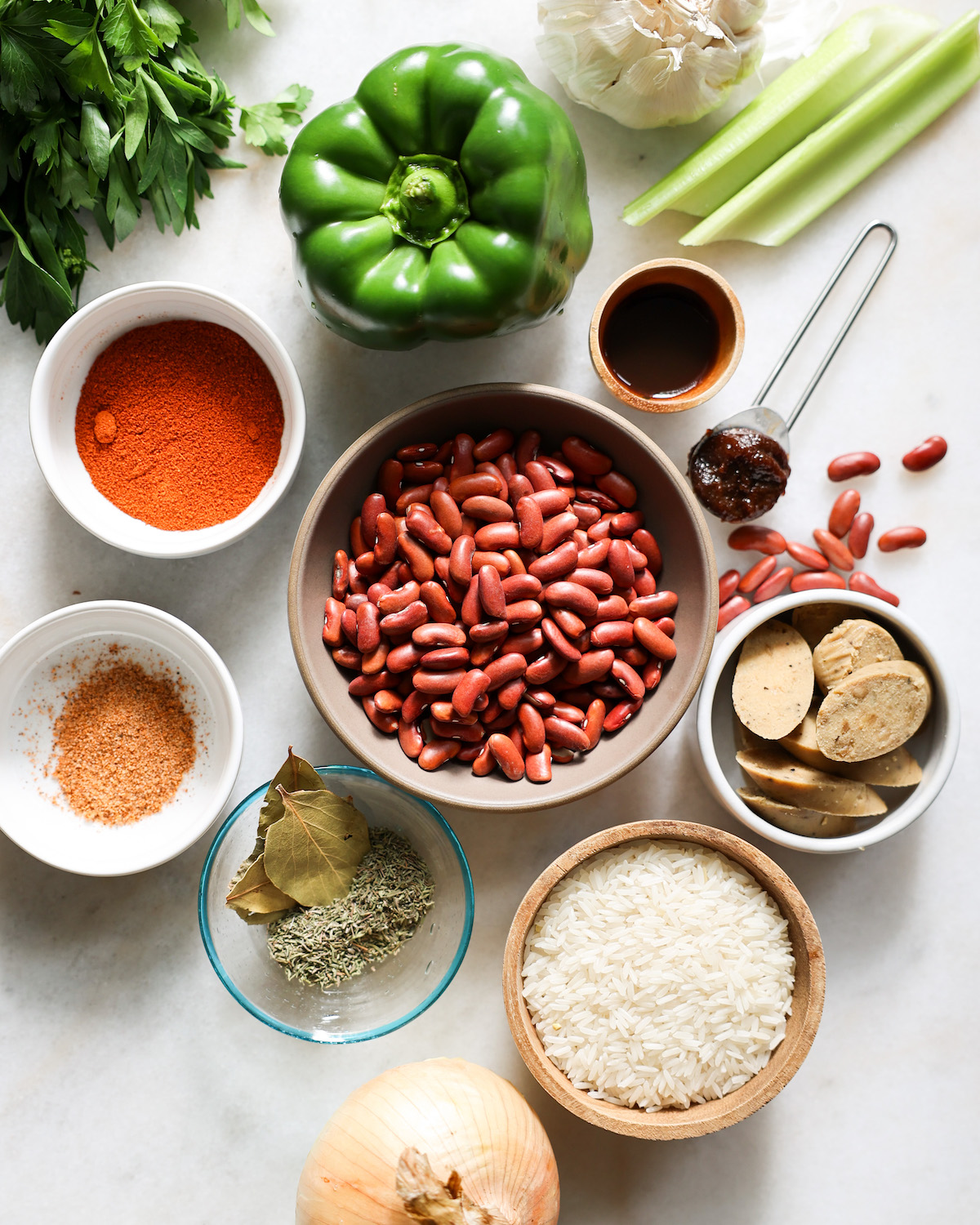 ingredients for red beans and rice on a white counter