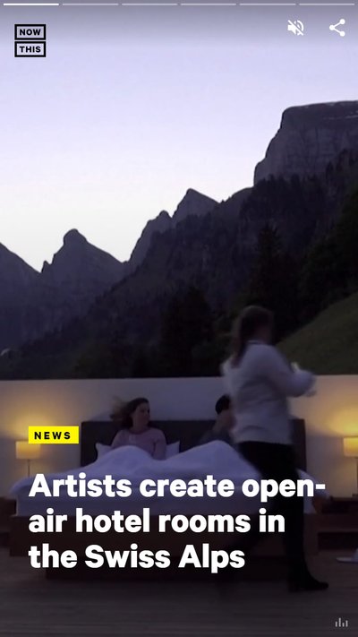 Two people lying in bed at an Open-air hotel room in the Swiss Alps