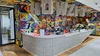 A view of the reception area in our Johannesburg, South Africa office. The wall is covered in a mural consisting of different colored triangles. A large art installation spelling “Howzit” in capital letters hangs above the desk.