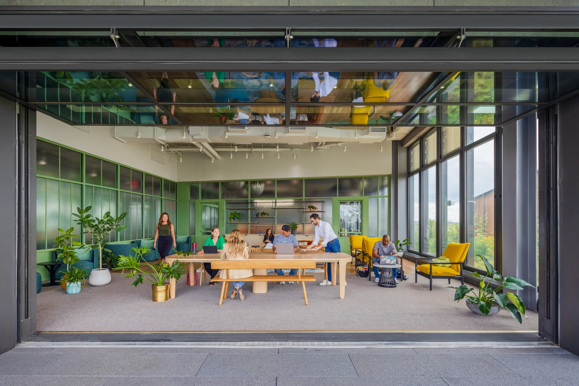 Googlers work in an indoor-outdoor common space in St. John's Terminal.