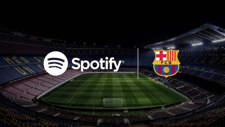 Spotify and FC Barcelona logos on dimly lit pitch background