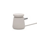 Belkin Boost Charge Pro 2-in-1 Wireless Charging Dock with MagSafe in Sand colour. MagSafe puck lying flat.