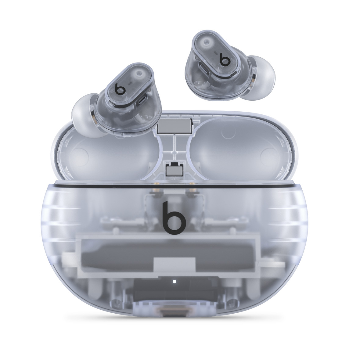 Écouteurs Beats Studio Buds + totalement sans fil avec réduction du bruit, en coloris Transparent avec le logo Beats, présentés au-dessus du boîtier de charge pratique.