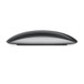 Side of Magic Mouse showing black surface and aluminum base.