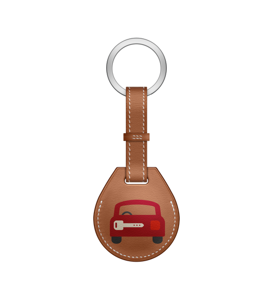 The AirTag Hermès Key Ring, in Voiture, is handcrafted by artisans in France, and is available in heritage Barénia leather or smooth Swift leather, with contrasted saddle stitching.