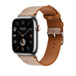Image montrant le bracelet Toile H simple tour gold (or) et écru, le cadran d’une Apple Watch et la Digital Crown.