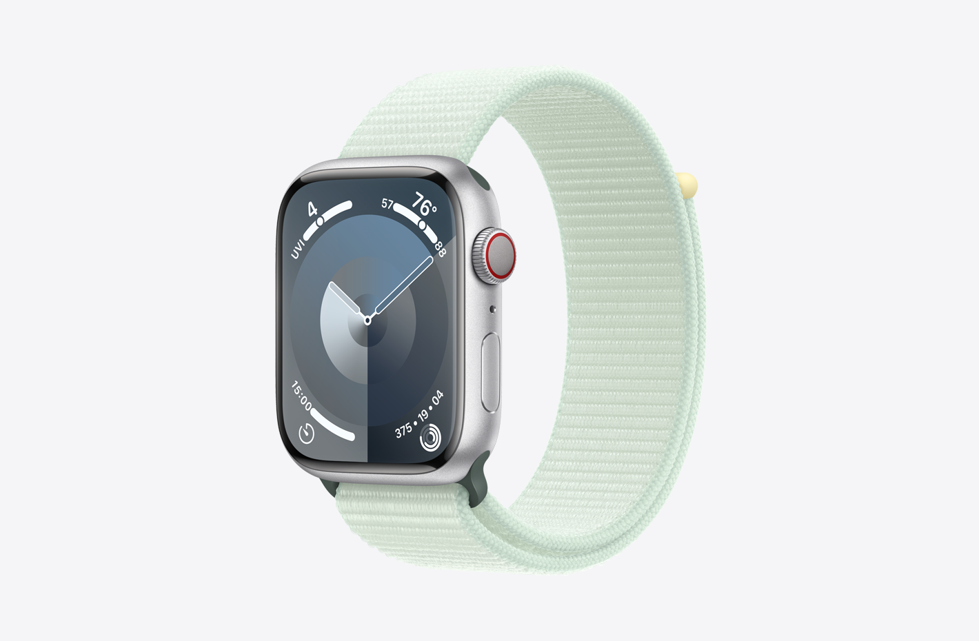 Apple Watch with Silver Aluminum case with matte finish and angled view of Soft Mint (green) Sport Loop, featuring a hook-and-loop fastener and double-layer nylon weave