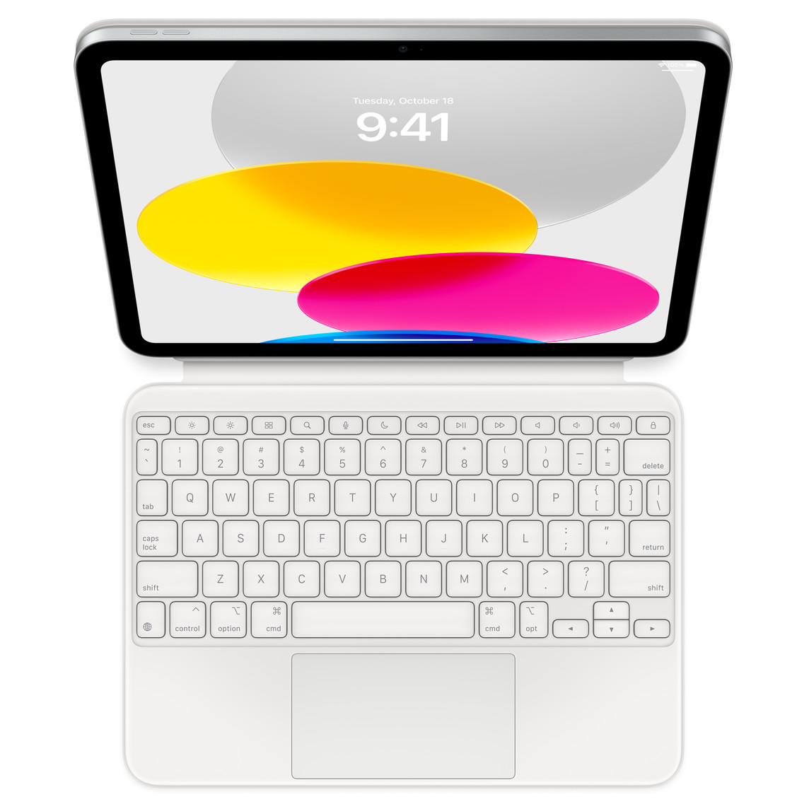 Top down view showing iPad connected to Magic Keyboard Folio laying flat. Screen displaying coloured circular graphics.