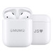Front view of AirPods (2nd generation) in an open Charging Case with engraving, next to a closed Charging Case with engraving. 