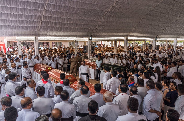 A mass funeral on Tuesday at St. Sebastian’s Church in Negombo, Sri Lanka. As many as 100 people were killed in a suicide bombing at the church on Easter Sunday.