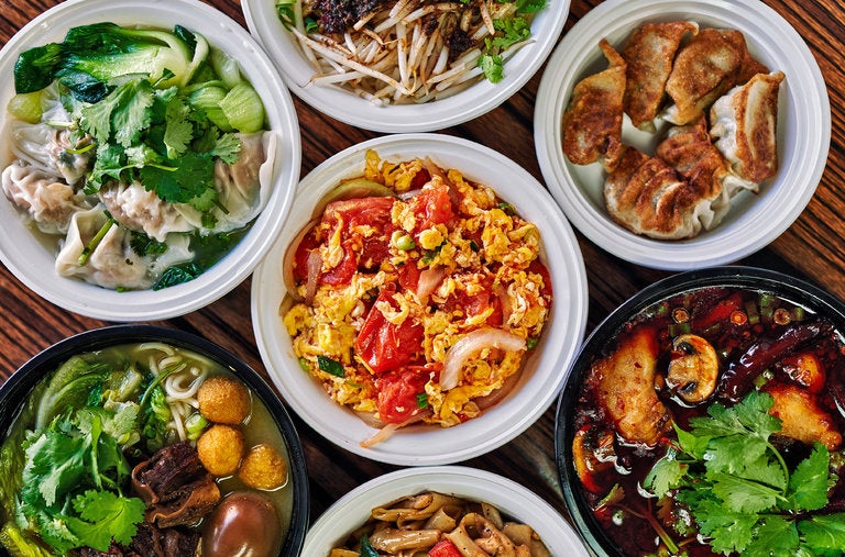 The menu centers on hand-folded dumplings and Sichuan-inflected noodle soups, but also veers into Thai and Korean dishes, and Chinese home-cooked staples like creamy scrambled eggs and tomatoes over rice.