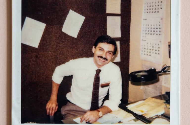 Donald Dimmock at his desk at The New York Times.