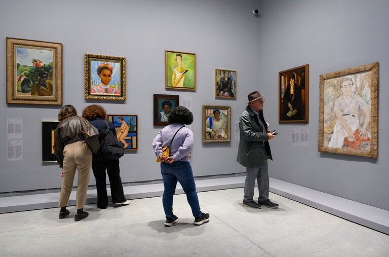 Paintings by 20th-century artists hang cheek by jowl in the Central Pavilion of the 2024 Venice Biennale. The nude at center left was painted by the pioneering Brazilian artist Tarsila do Amaral.
