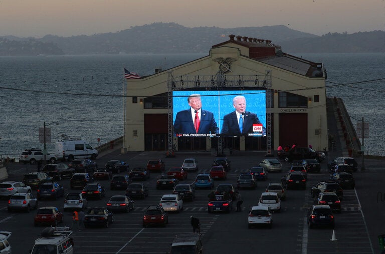 A debate in 2020 between Donald J. Trump and Joseph R. Biden Jr. was shown during a drive-up watch party in San Francisco.