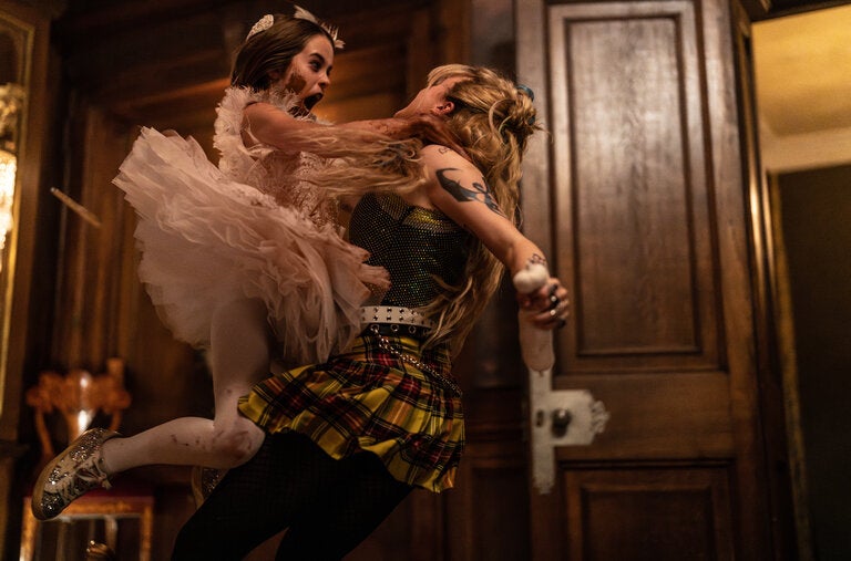 In the new film “Abigail,” Alisha Weir, left, plays a young ballet student who is actually a centuries-old vampire.