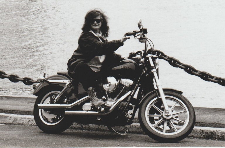 Barbara Joans on a Harley-Davidson motorcycle in the 1990s. She wrote about, researched and experienced motorcycle culture after buying her first bike in her 50s.
