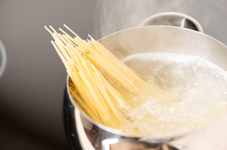 A rolling boil helps keep pasta noodles from sticking together in the pot, but so does frequent stirring.