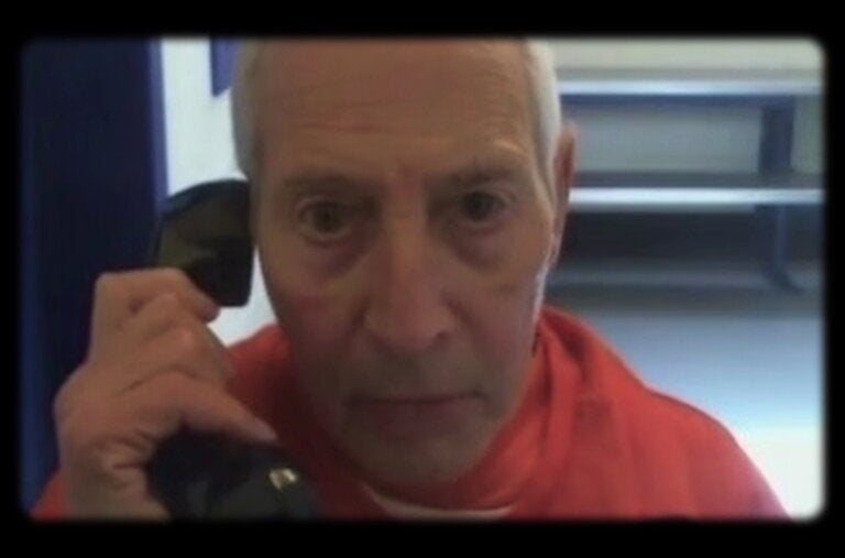 Robert Durst, the subject of “The Jinx,” Part Two of which opened Sunday, talking on a jailhouse phone. Durst, who was serving a life sentence, died in prison in 2022.