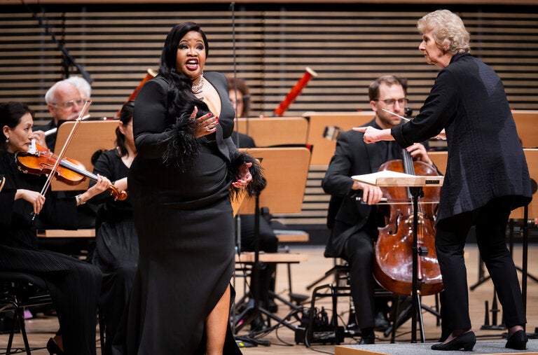 The soprano Karen Slack, left, and the conductor Jane Glover appearing with the New York Philharmonic at David Geffen Hall on Wednesday.
